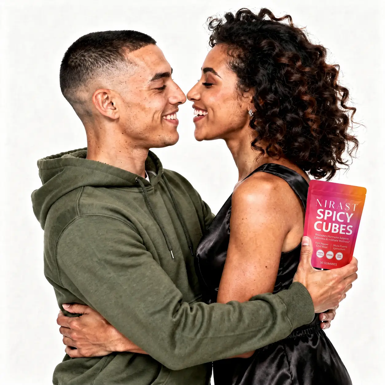 Couple embracing, holding a pouch of Nirast Spicy Cubes